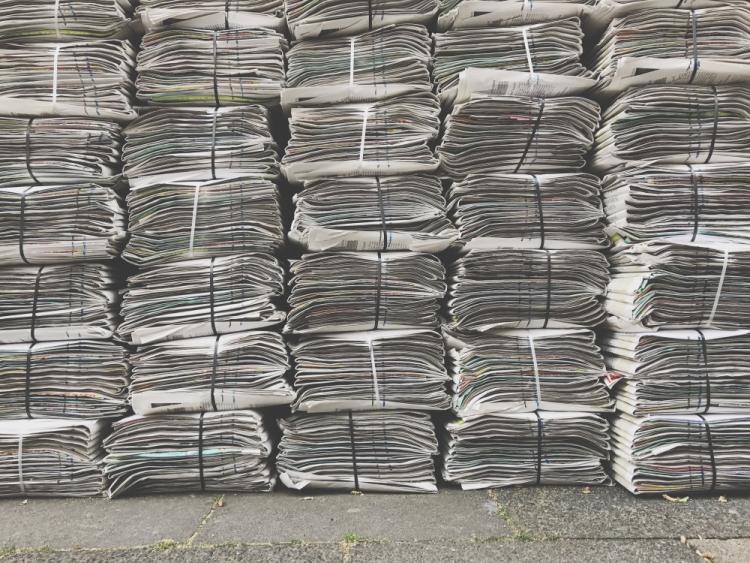 Stacked newspapers