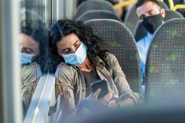 exhausted woman on train 