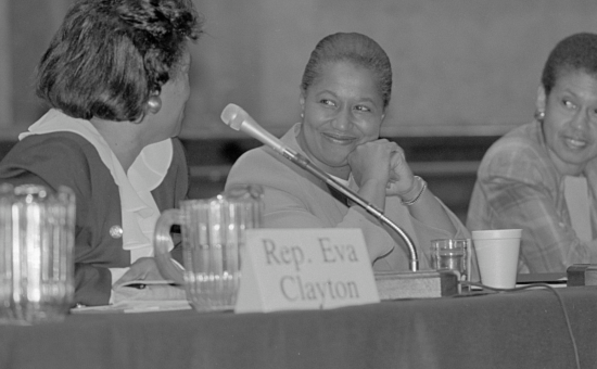 Seated at a table (left to right) Representative Eva Clayton, Senator Carol Moseley-Braun and Delegate Eleanor Holmes Norton, possibly at a Congressional Black Caucus meeting